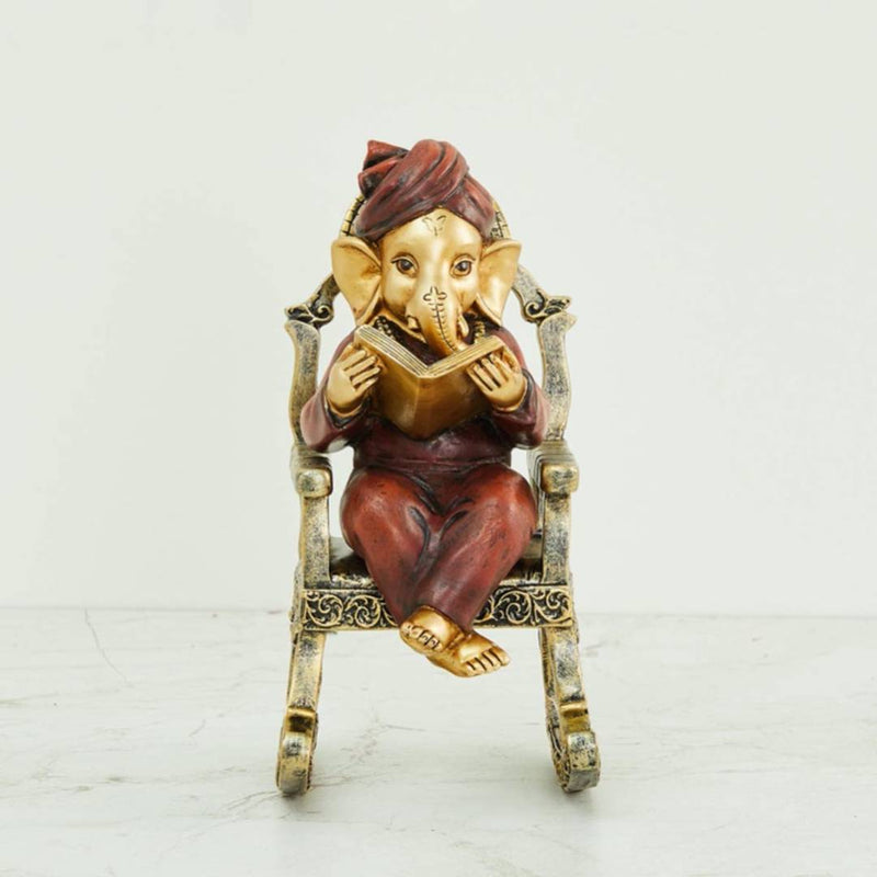 Home Centre Alpana Ganesha Sitting on Chair Figurine