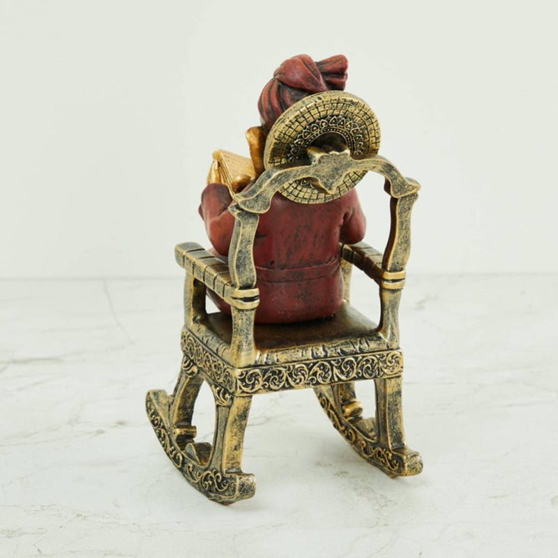 Home Centre Alpana Ganesha Sitting on Chair Figurine