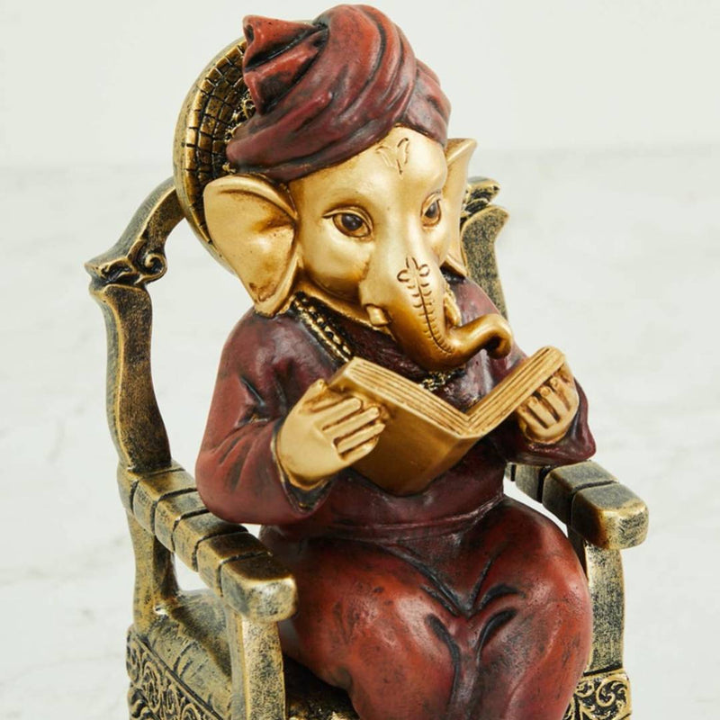 Home Centre Alpana Ganesha Sitting on Chair Figurine